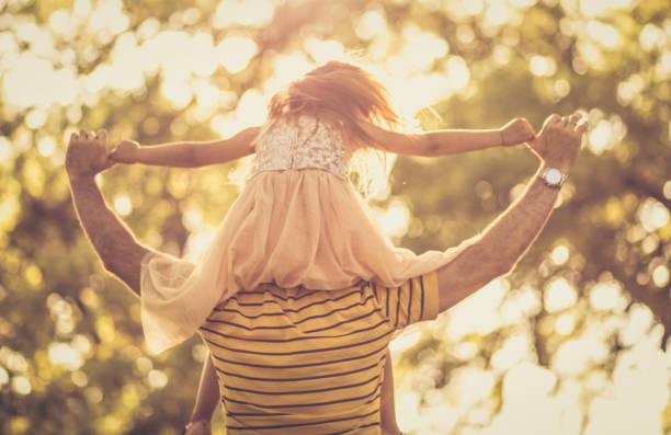 istock Little girl enjoying outdoors. Time with daddy is precious. 1049320588