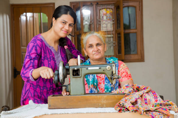 istock Mother & Daughter Sewing - stock images 1049321364