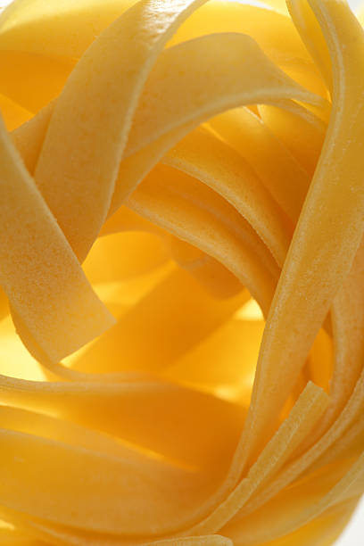 Dried macro noodles yellow pasta, studio shot