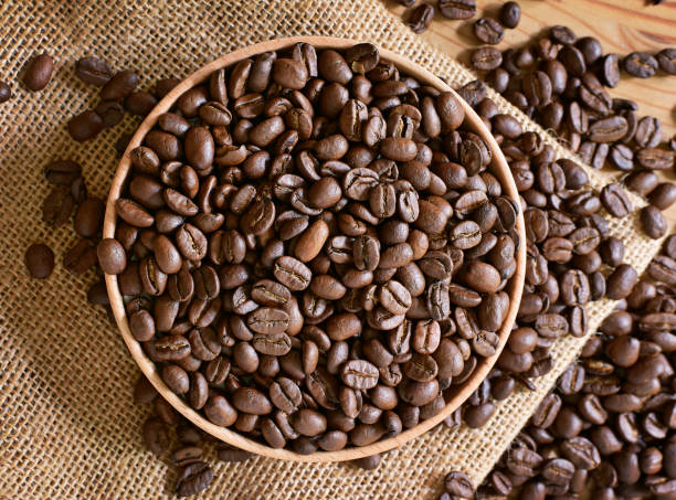 istock Roasted coffee beans in a wooden bowl 1049328036