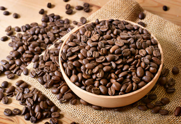 istock Roasted coffee beans in a wooden bowl 1049328118