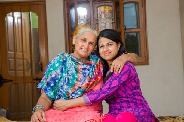 istock Mother daughter looking at camera - stock images 1049334906