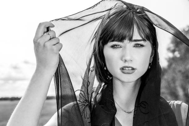 istock Beautiful woman with black veil over her head 1049335008