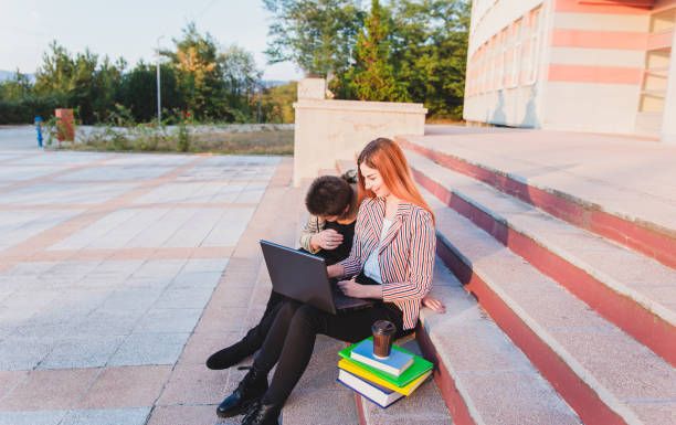 istock Happy young college girls 1049335230