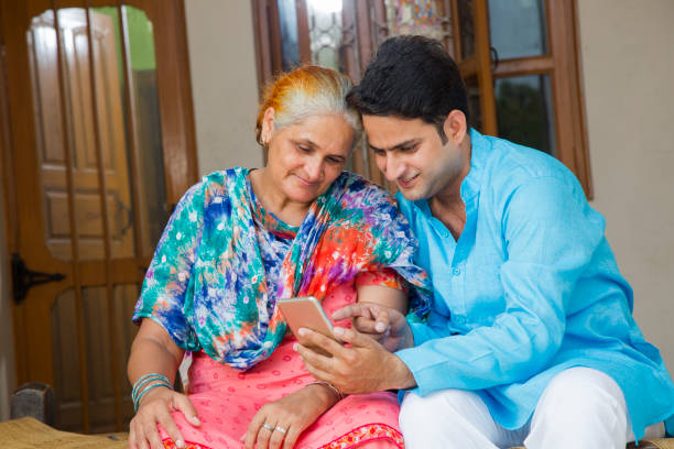 istock Mother son using phone - stock images 1049335250