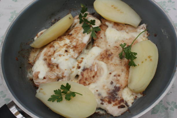 istock Turkey cutlets cooked with fresh cream and boiled potatoes 1049335702