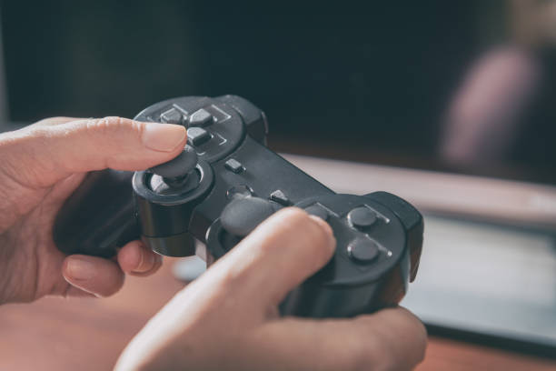 istock Woman plays video game using the gamepad 1049338392