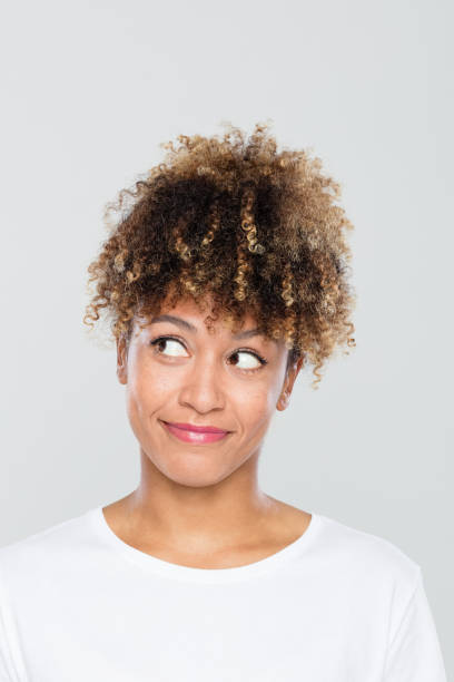 istock Cute afro american woman wondering 1049338892