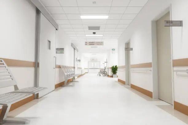 Corridor of an empty modern Japanese hospital with Japanese and English signages.
