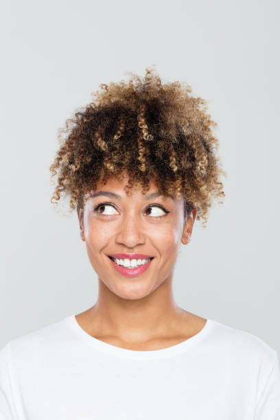 istock Cute afro american woman looking away 1049339626