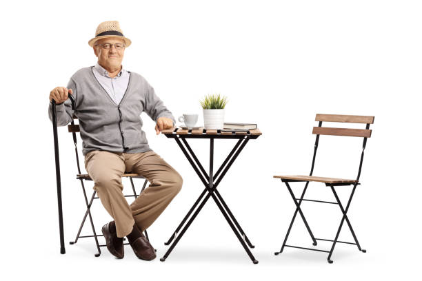 istock Mature man seated at a coffee table 1049341502