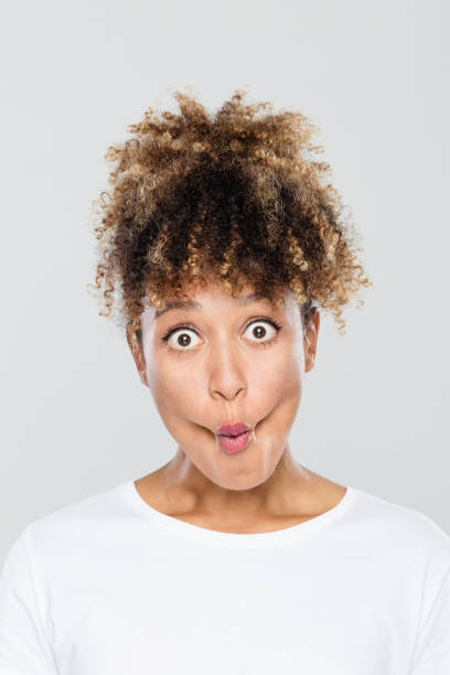 istock Afro american young woman making funny faces 1049345556
