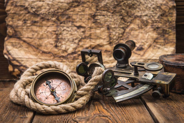 istock nautical equipment on the old map background 1049346498