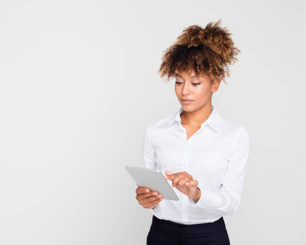 istock Afro american businesswoman using digital tablet 1049349900