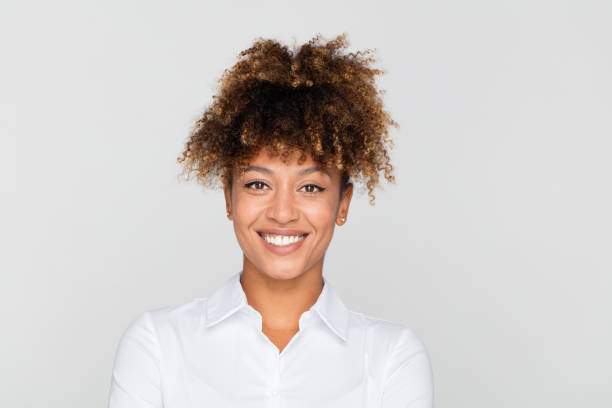 istock African businesswoman looking happy 1049350032