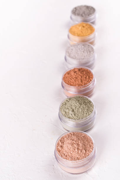 istock Set of different cosmetic clay mud powders on white background 1049354704
