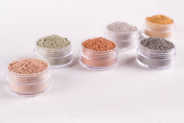 istock Set of different cosmetic clay mud powders on white background 1049354706