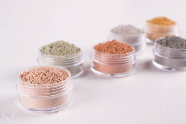 istock Set of different cosmetic clay mud powders on white background 1049354726