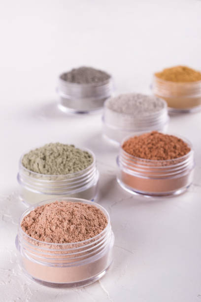 istock Set of different cosmetic clay mud powders on white background 1049354732