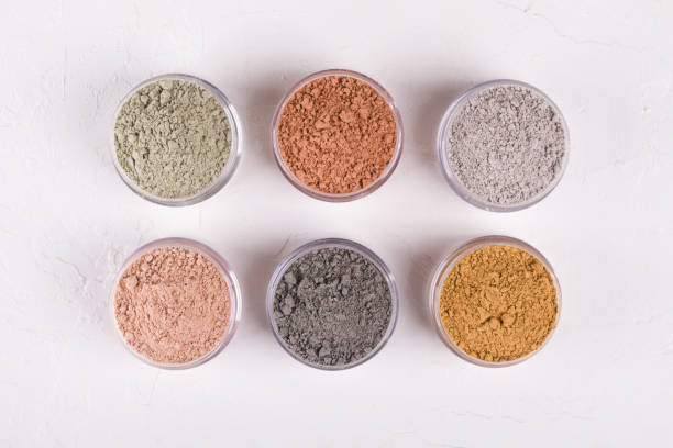 istock Set of different cosmetic clay mud powders on white background 1049354752