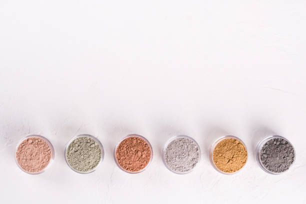 istock Set of different cosmetic clay mud powders on white background 1049354782