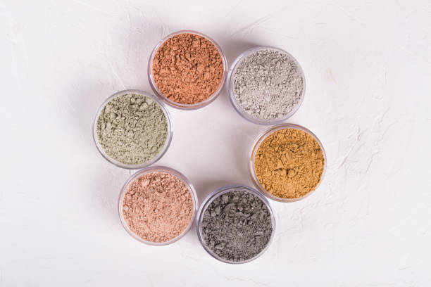istock Set of different cosmetic clay mud powders on white background 1049354810