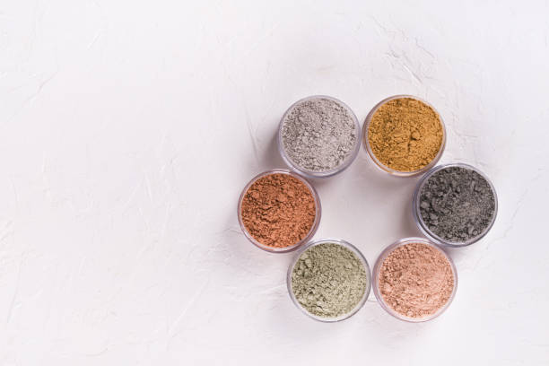 istock Set of different cosmetic clay mud powders on white background 1049354894