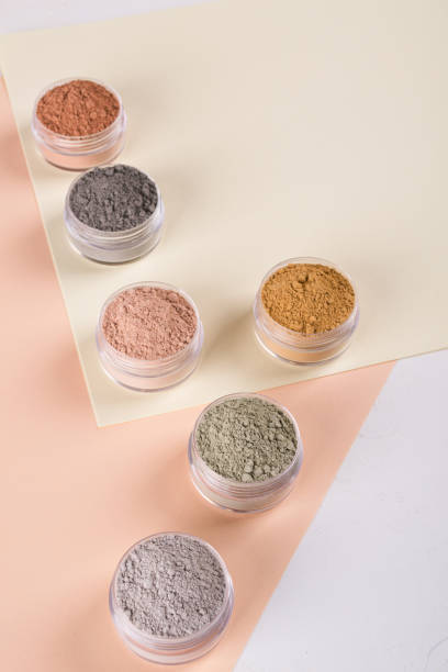 istock Set of different cosmetic clay mud powders on white background 1049355124