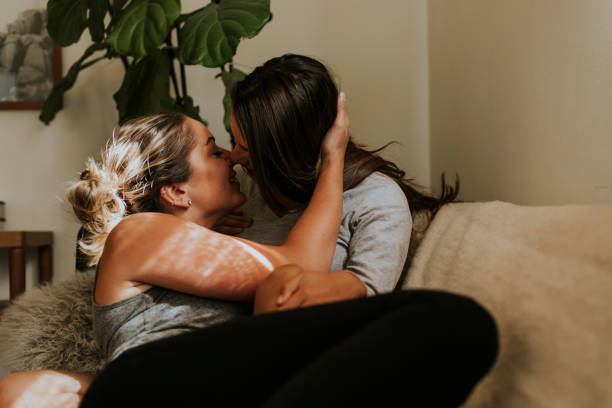 istock Sweet lesbian couple on the sofa 1049355130
