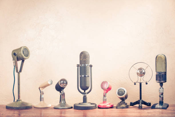 retro old microphones on table. vintage style filtered photo - 1960s style 1950s style record retro revival imagens e fotografias de stock