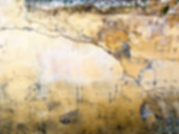 istock Bokeh blurred phototography. Texture of an old wall. Decayed plaster. Mockup. Background 1049368808