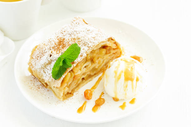 istock apple strudel with cinnamon and an ice cream ball. 1049369554