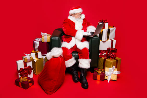 istock Full legs body size calm aged mature reader Saint Nicholas in shoes spectacles tradition costume white beard isolated on red shine background with winter December noel eve email later from children 1049372984
