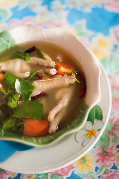 Herb chicken leg spicy soup Fresh prepared asian herb chicken leg spicy soup served with vegetables. Traditional thai cuisine made of fresh ingredients. claw photos stock pictures, royalty-free photos & images