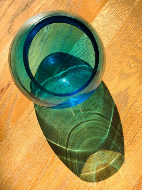 Blue glass vase on wooden table