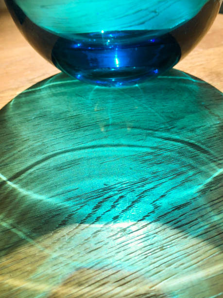 istock Blue glass vase on wooden table 1049388526