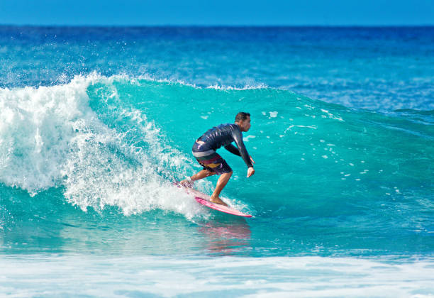 istock Surfer Surfing in Poipu Beach, Kauai,Hawaii 1049389682