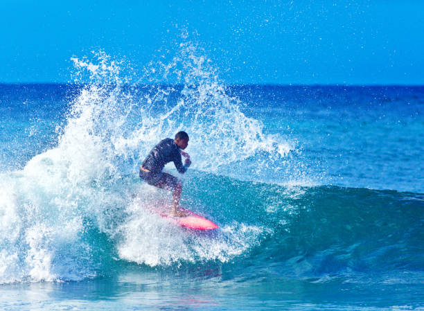 istock Surfer Surfing in Poipu Beach, Kauai,Hawaii 1049389712