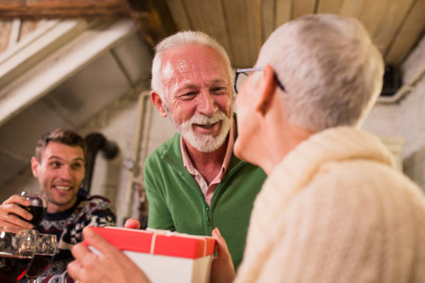 istock Senior man giving his wife a present 1049395612