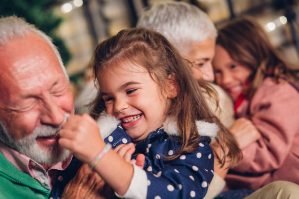 istock Young girls having fun with grandparents 1049396318