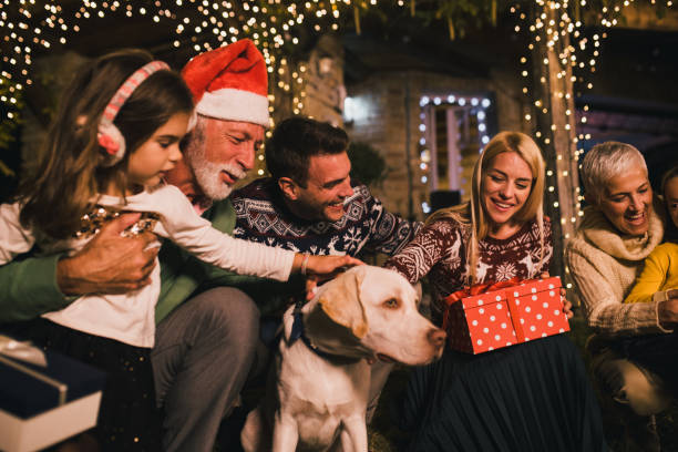 istock Happy family with Christmas present and a pet 1049399672