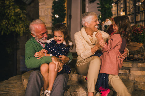 istock Grandparents playing with two young girls 1049400452