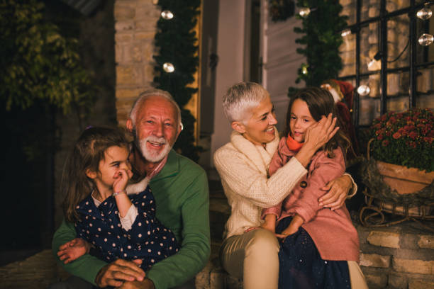 istock Happy family hugging outdoors 1049400588