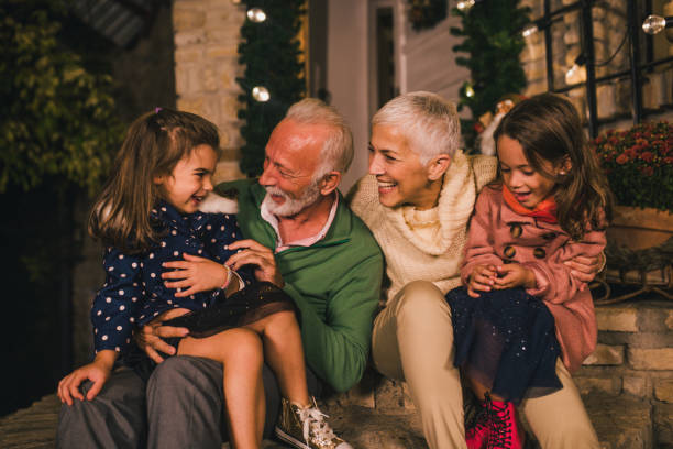 istock Smiling old couple with children 1049400594