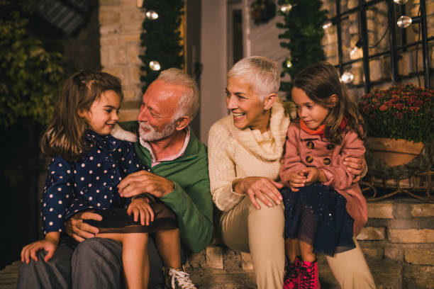 istock Mature couple with granddaughters 1049400596