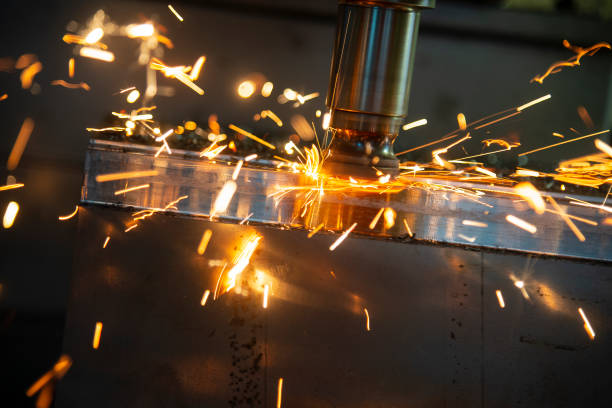 istock The CNC milling machine cutting the mold part in roughing  process with the burning  ship. 1049403048