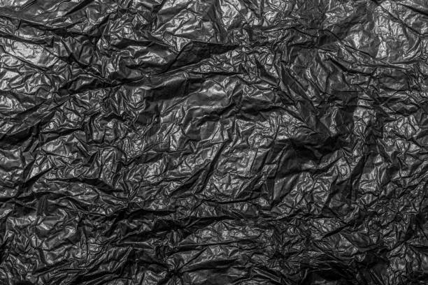 istock Black Paper Texture, Crumpled Paper Texture 1049403384