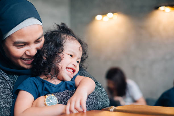 istock Muslim Mother and Daughter Playing Together 1049403400