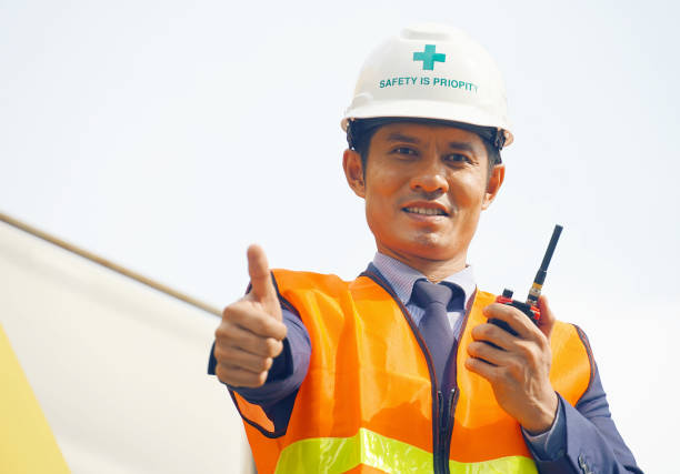 istock Engineer team wear helmet and use radio communication for job control at construction site working 1049403702
