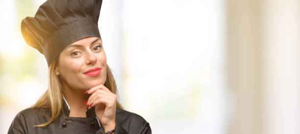 istock Young cook woman thinking and looking up expressing doubt and wonder 1049407614